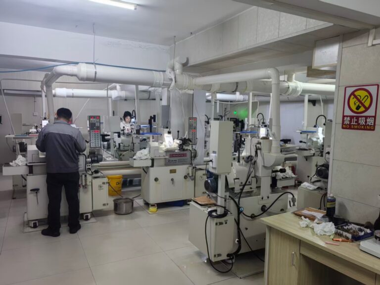 Precision rod lens grinding process at HSD Optical — where centration is controlled at the spindle